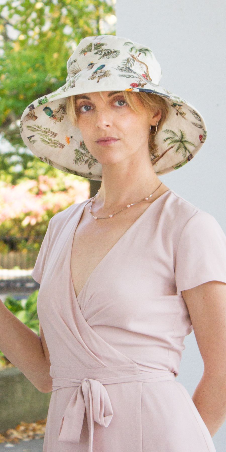 Elegant wide brim linen sun hat.  Stunning tropical palms and rainforest birds in soothing colours. UPF50 Sun Protection. Made in Canada by Puffin Gear