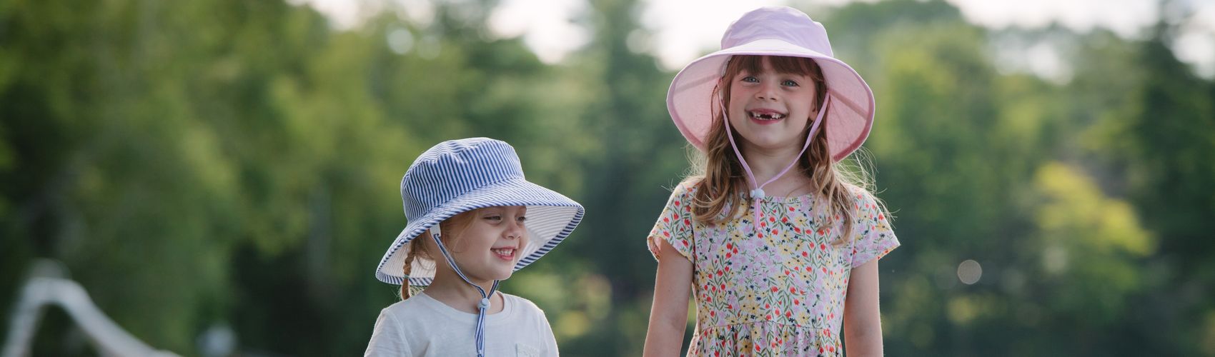 Wide brim kids sun protection hats with UPF50 sun protection built in.  Hats have chin ties with cord lock and safety break away clips.  Machine washable.  Made in Canada.  Outdoor Play Hats