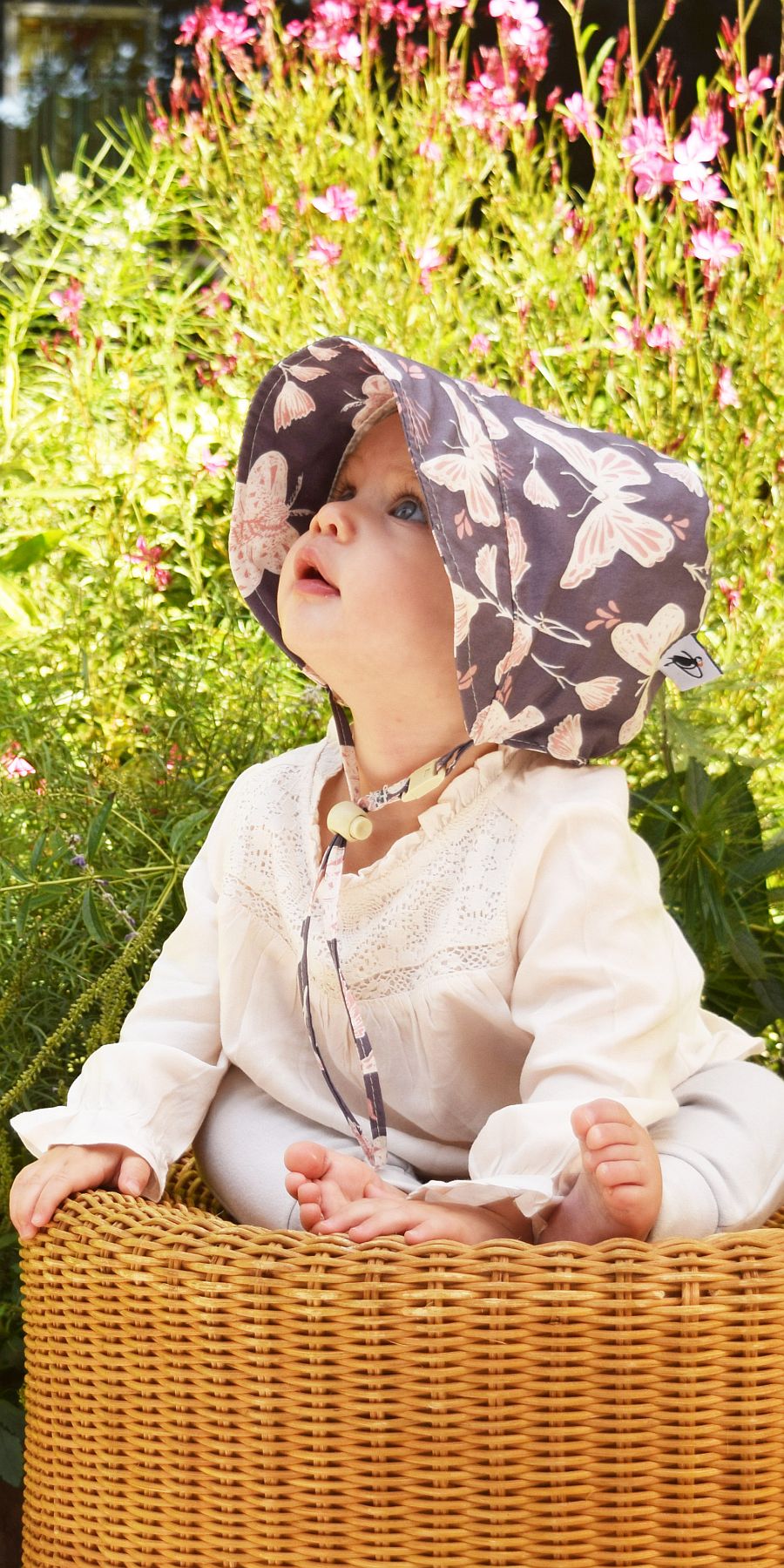 Infant and Toddler Sun Protection Summer Bonnet. Rated UPF50+ Excellent Sun Protection.  Choose from beautiful prints, classic oxford cotton or linen.  Made in Canada by Puffin Gear
