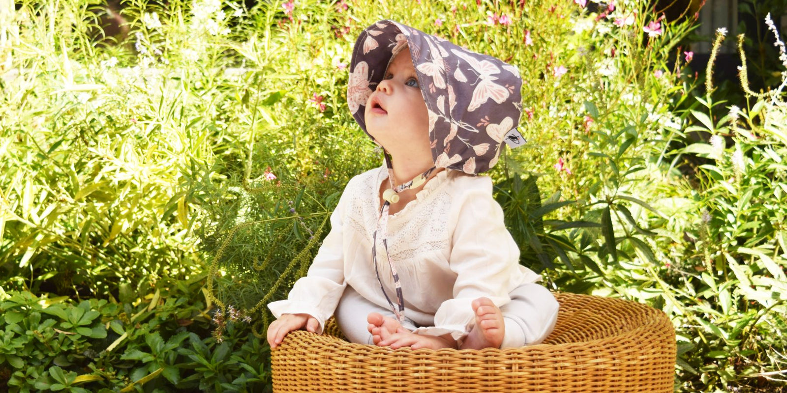 Infant and Toddler Sun Protection Summer Bonnet. Rated UPF50+ Excellent Sun Protection.  Choose from beautiful prints, classic oxford cotton or linen.  Made in Canada by Puffin Gear
