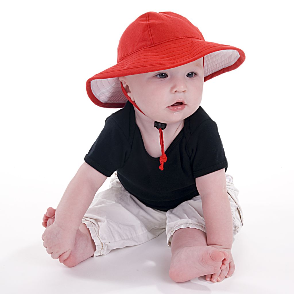 Infant brimmed sunbeam hat with chin tie, toggle and safety break away clip.  Available in organic cotton solids or beautiful prints.  Tested and rated UPF50+ Excellent Sun Protection. Carefully Made in Canada by Puffin Gear